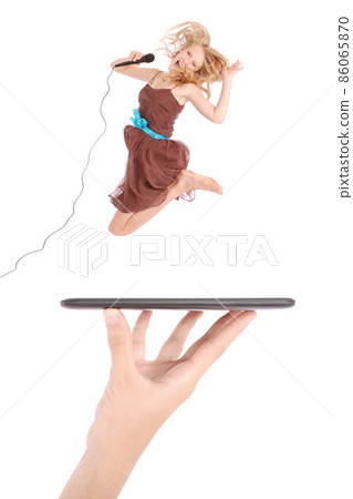 Young girl jump using tablet pc on people hand Young girl jump using tablet pc on people hand 86065870