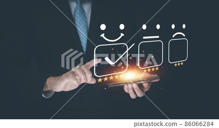 Happy and unhappy Smile face concept,Customer service and Satisfaction concept,Business people touch virtual screen on the happy Smile face icon to give satisfaction in service, rating very impressed. 86066284