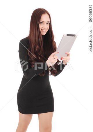 Girl in movement holds tablet computer Girl in movement holds tablet computer 86066582