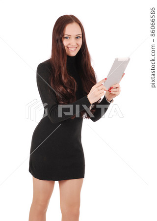 Girl in movement holds tablet computer Girl in movement holds tablet computer 86066586