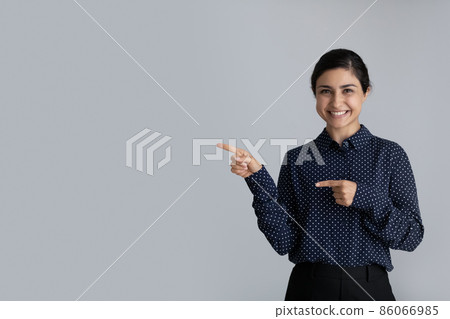 Happy young Indian girl looking at camera Happy young Indian girl looking at camera 86066985