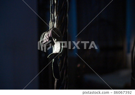 BDSM Leather handcuffs for role-playing games on a black background. Bondage for carnal pleasures. Domination and submission. BDSM Leather handcuffs for role-playing games on a black background. Bondage for carnal pleasures. Domination and submission. 86067392