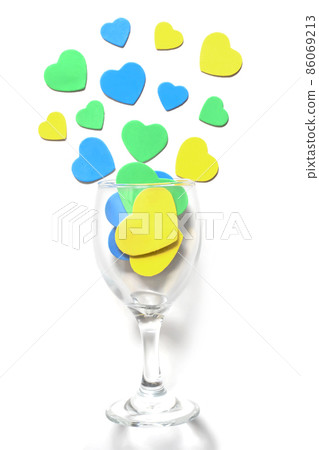 Valentine's Day background. Multi-colored hearts in a glass, isolated in white 86069213