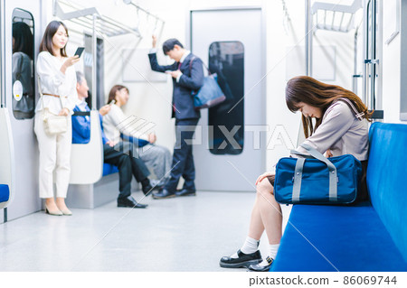 High school girl suffering from abdominal pain on the train 86069744