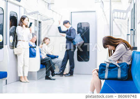 High school girl suffering from abdominal pain on the train 86069748