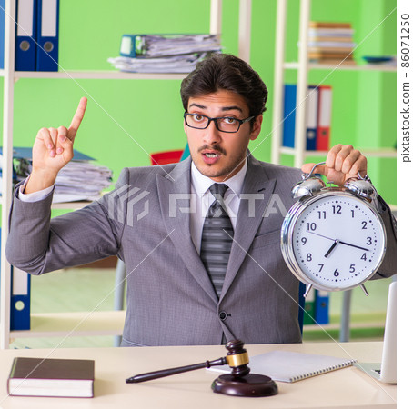 Young handsome lawyer working in the office 86071250