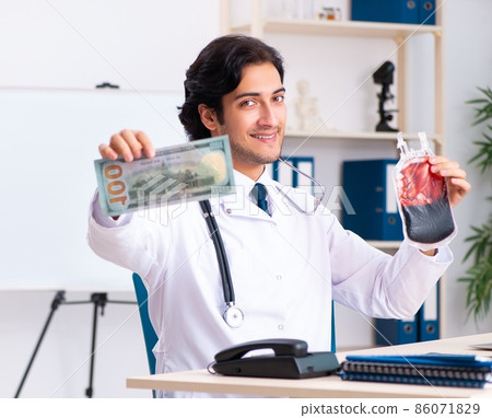 The young handsome doctor in blood transfusion concept The young handsome doctor in blood transfusion concept 86071829