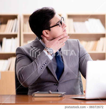 Sick businessman in the office Sick businessman in the office 86072672