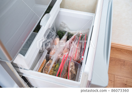 Frozen stock of various ingredients in the refrigerator Frozen stock of various ingredients in the refrigerator 86073360
