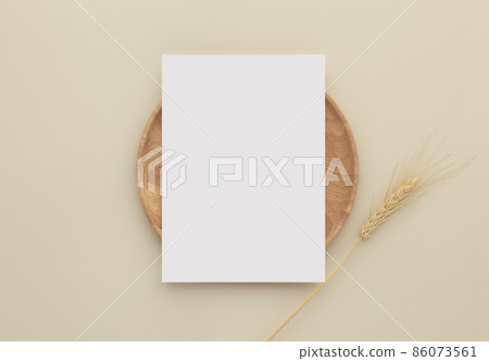 Blank paper cards, Mockup with a wheat on a wooden plate, beige background, Minimal beige workplace composition, flat lay, mockup 86073561