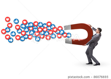 Businessman attracting likes with large magnet 86076693