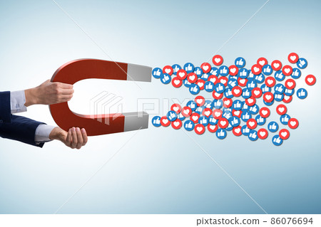 Businessman attracting likes with large magnet 86076694