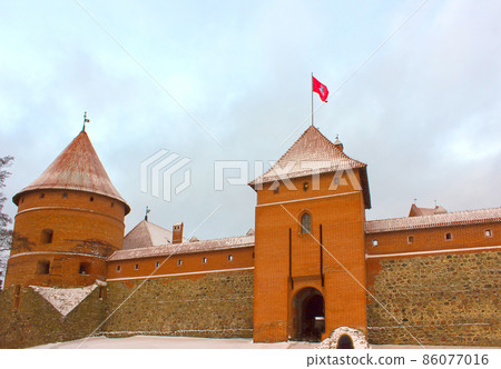 Trakai Castle in winter - Island castle in Trakai, Lithuania. It is one of the most popular tourist destinations in Lithuania, houses a museum and a cultural centre. Trakai Castle in winter - Island castle in Trakai, Lithuania. It is one of the most popular tourist destinations in Lithuania, houses a museum and a cultural centre. 86077016