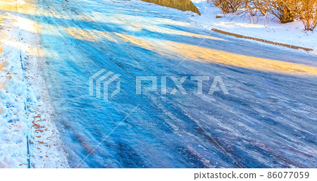 The icy road in winter at Vilnius, Lithuania. 86077059
