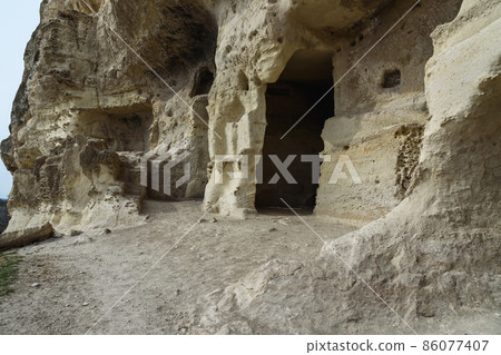 Caves in the rock Cave city Chufut-Kale in Bakhchysarai, Crimea Caves in the rock Cave city Chufut-Kale in Bakhchysarai, Crimea 86077407