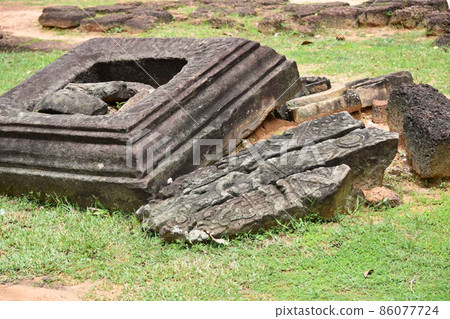 Broken stones at the Preah Ko ruins Broken stones at the Preah Ko ruins 86077724