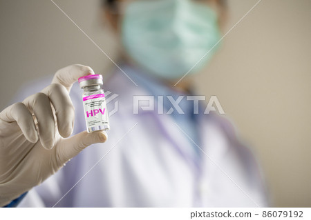HPV (Human Papillomavirus) Doctor or scientist holding liquid vaccines HPV vaccine.viruses Some strains infect genitals and can cause cervical cancer. HPV (Human Papillomavirus) Doctor or scientist holding liquid vaccines HPV vaccine.viruses Some strains infect genitals and can cause cervical cancer. 86079192