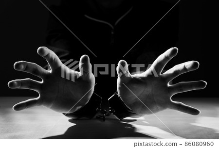 Arrested criminal hands locked in handcuffs. 86080960