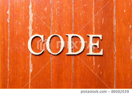 Alphabet letter in word code on old red color wood plate background Alphabet letter in word code on old red color wood plate background 86082039