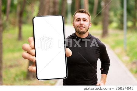 Man showing white empty smartphone screen, closeup 86084045