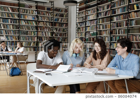 Mixed race group of students enjoying working together Mixed race group of students enjoying working together 86084074