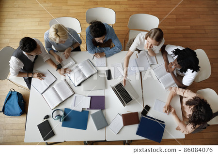 Team of young college students working on study project Team of young college students working on study project 86084076