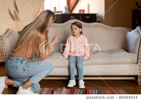 Family Conflict. Angry mother scolding sad daughter 86084654