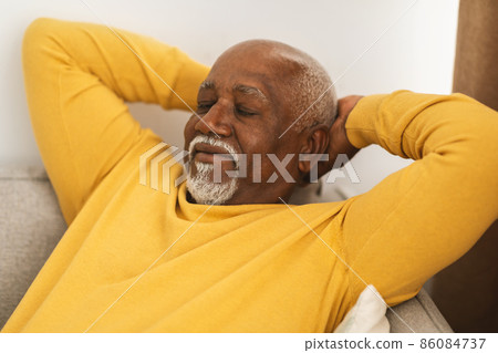 Mature African American Male Sleeping Relaxing On Couch At Home Mature African American Male Sleeping Relaxing On Couch At Home 86084737