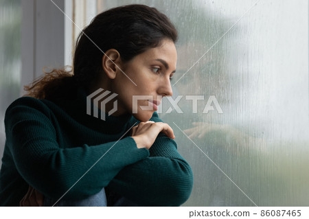 Stressed young hispanic woman suffering from negative thoughts. Stressed young hispanic woman suffering from negative thoughts. 86087465