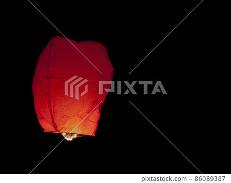 Red Thai sky lantern in mid-air 86089387