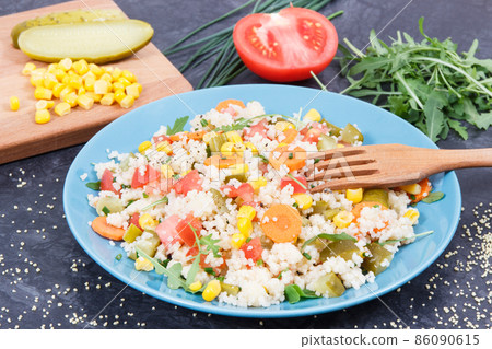Fresh salad with couscous and vegetables. Light dietary vegan meal Fresh salad with couscous and vegetables. Light dietary vegan meal 86090615
