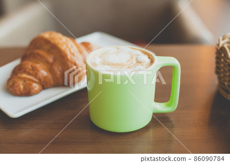 Coffee cup in city street cafe 86090784