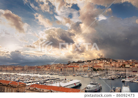 Aerial panoramic view on basilica of Notre Dame de la Garde and old port in Marseille, France Aerial panoramic view on basilica of Notre Dame de la Garde and old port in Marseille, France 86092473