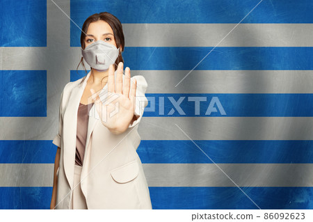 Woman in protective mask on Greece flag background 86092623