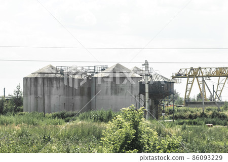Abandoned fuel oil storage tanks at an industrial plant Abandoned fuel oil storage tanks at an industrial plant 86093229