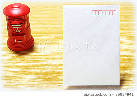 [Illustration style] Mailbox-shaped piggy bank and mail envelope (with copy space) placed on a wooden table 86094941