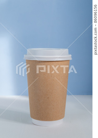 group of paper cups against blue background, greenwashing concept 86096156