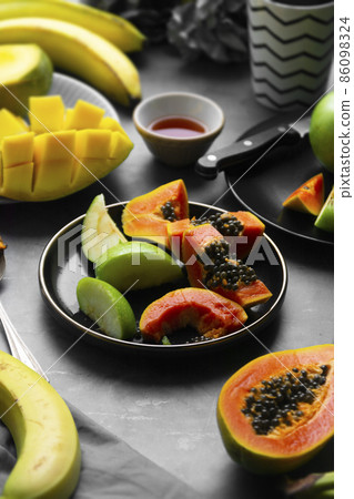 Summer food. Papaya, apple, banana healthy snacks. Summer food. Papaya, apple, banana healthy snacks. 86098324