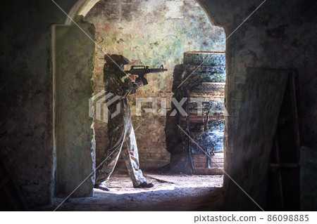 soldier training while playing paintball in the fortress 86098885