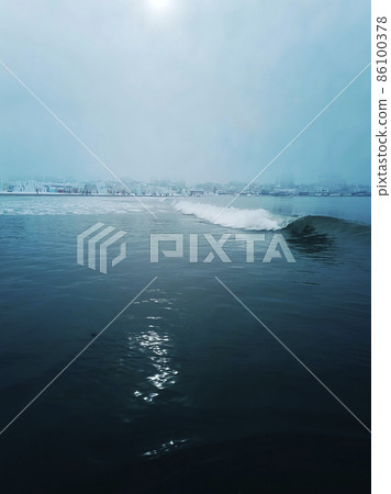 One wave spirals across the sea surface.  86100378