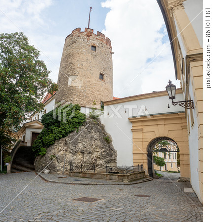 Old stony Mikulov castle tower against the blue sky. Old stony Mikulov castle tower against the blue sky. 86101181