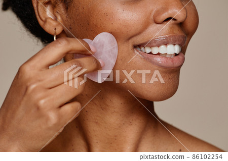 Natural Black Woman Enjoying Face Massage 86102254