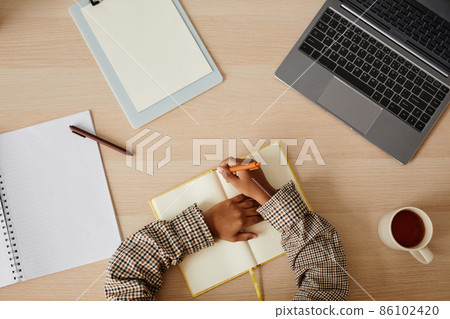 Boy Studying at Home Top View Boy Studying at Home Top View 86102420