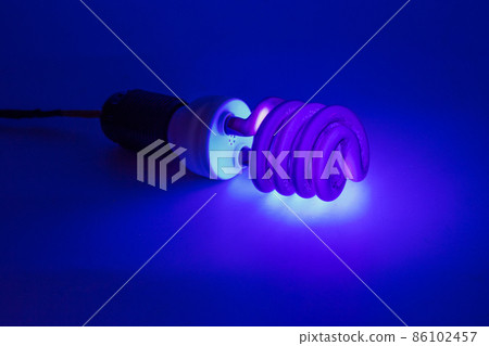 compact UV - ultraviolet CCFL - Cold Cathode Fluorescent Lamp on white surface 86102457