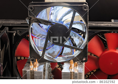 stopped 90 mm pc fan close-up with thick layer of dust stopped 90 mm pc fan close-up with thick layer of dust 86102592
