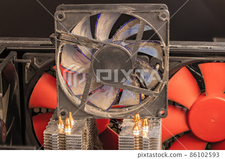 stopped 90 mm pc fan close-up with thick layer of dust 86102593