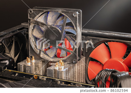 stopped 90 mm pc fan close-up with thick layer of dust stopped 90 mm pc fan close-up with thick layer of dust 86102594