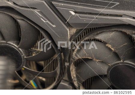 dusty black pro gaming graphic card fan blades with dust, airborne fur and hairs close-up dusty black pro gaming graphic card fan blades with dust, airborne fur and hairs close-up 86102595