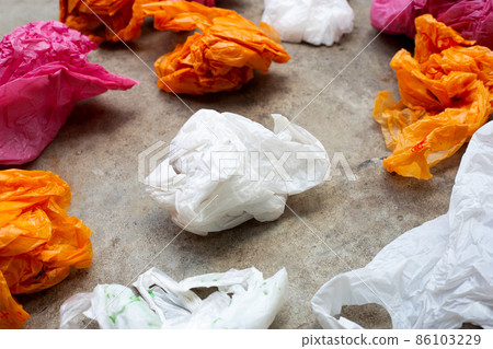Colorful plastic bags on cement floor Colorful plastic bags on cement floor 86103229