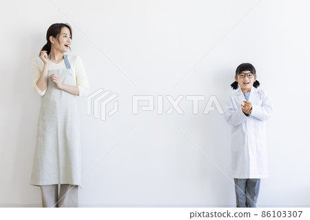 Girl in a lab coat and a housewife Girl in a lab coat and a housewife 86103307